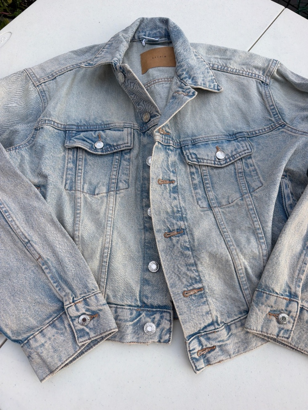 NWOT & Denim jacket in a light wash with chest pockets, designed for women in a